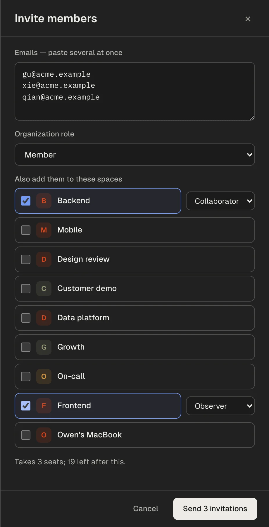 The invite drawer: email addresses, organization role, spaces to add them to, and the seats it will take.
